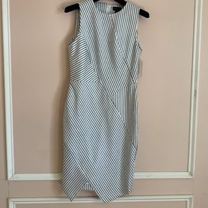 Asymmetrically sewn dress in navy and white by Carlisle Collection.